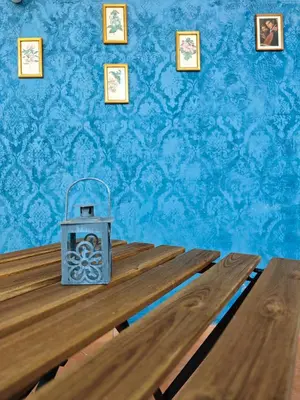 a large room with two chairs and large windows at NBHouse in Palermo