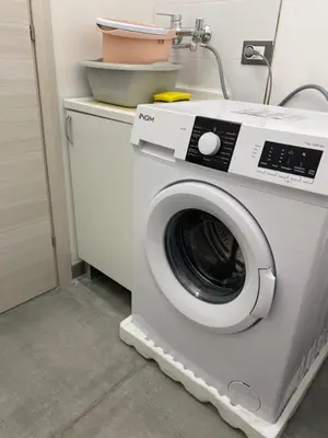 a washing machine in a room with at San Vito Holiday Home in San Vito lo Capo