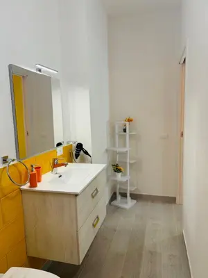 a bathroom with a sink and a mirror at Sirio rooms and apartments in Carini