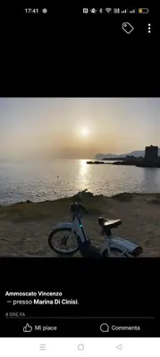 a picture of a motorcycle parked next to the water at LA TERRAZZA SUL MARE camera vicino aereoporto&mare SICILIAN VINTAGE STYLE SEASIDE ROOM in Cinisi
