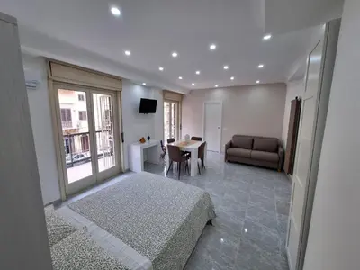 a living room with a couch and a table at Casa cannella in Palermo