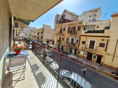 a balcony with a view of a city at Casa cannella in Palermo