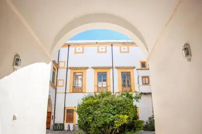 an archway with a building in the background at Resuttano Loft in Palermo