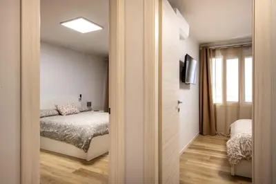 a bedroom with a bed and a window at Villareale Flat - Palermo City Center Free Parking in Palermo