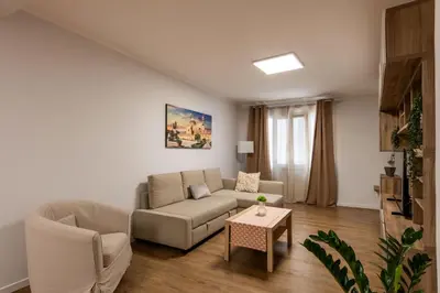 a living room with a couch and a table at Villareale Flat - Palermo City Center Free Parking in Palermo