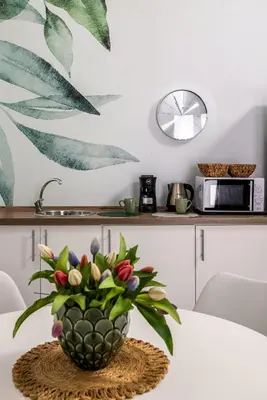 a white bedroom with a bed and a bathroom at Casa Azzurra Rooms e apartment in Terrasini