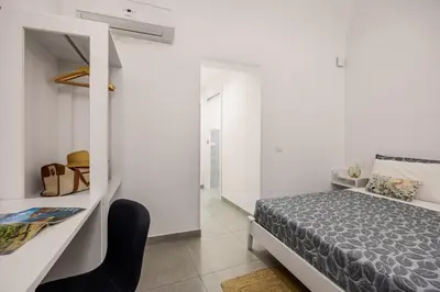 a room with a sign on the wall at Casa Azzurra Rooms e apartment in Terrasini