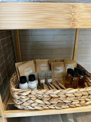 a basket filled with bottles of honey on a shelf at Marina Rooftop Exclusive View in Palermo