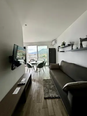 a living room with a couch and a table at Marina Rooftop Exclusive View in Palermo