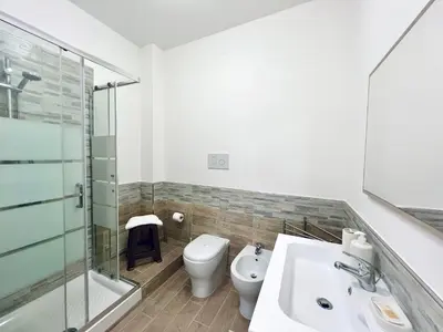 a bathroom with a toilet and a sink and a shower at Domus Livi in Cinisi