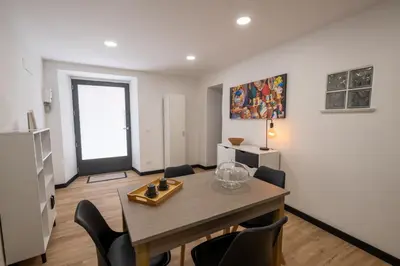a kitchen and dining room with a table and chairs at aprimaManu apartment in Monreale
