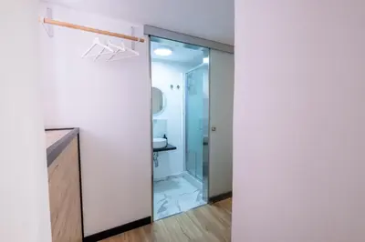 a bathroom with a shower and a glass door at aprimaManu apartment in Monreale