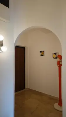 an empty room with a red fire hydrant in it at Appartamento Strasburgo in Palermo