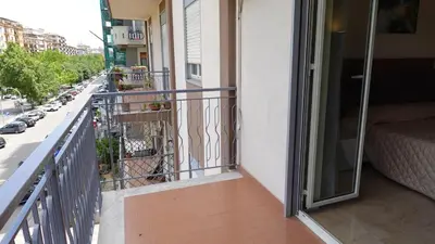 a balcony with a view of a street at Appartamento Strasburgo in Palermo