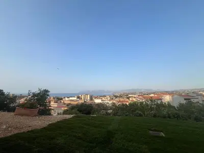 a view of a city from a field of grass at Tenuta Rapillo in Castellammare del Golfo