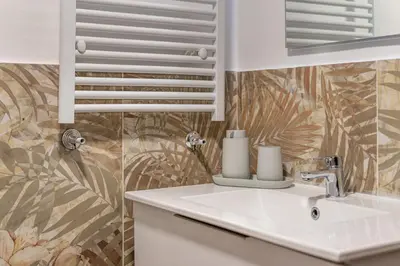 a bathroom with a sink and a mirror at Dasaro in Palermo