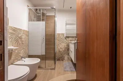 a bathroom with a toilet and a sink and a shower at Dasaro in Palermo