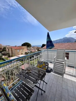 a group of chairs and umbrellas on a beach at Mongibello Rooftop in Mondello