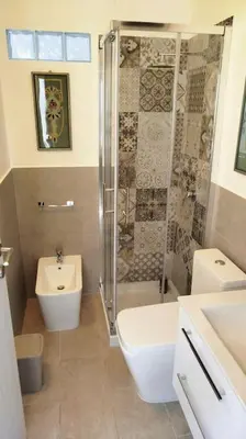 a bathroom with a shower and a toilet and a sink at 7 floor in Palermo
