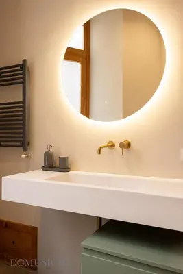 a bathroom with a sink and a mirror at Lofterì by DomuSicily in Palermo