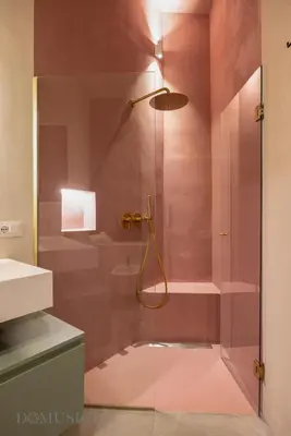 a shower with a glass door in a bathroom at Lofterì by DomuSicily in Palermo