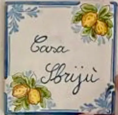 a picture of a cake with flowers on it at Ballar'Home - Casa Sbriju' in Palermo