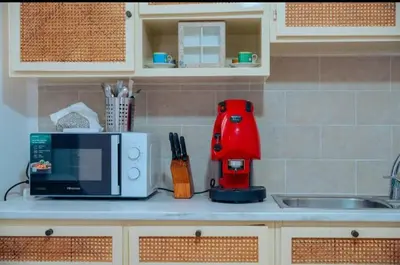 a kitchen counter with a microwave and a sink at Ballar'Home - Casa Sbriju' in Palermo