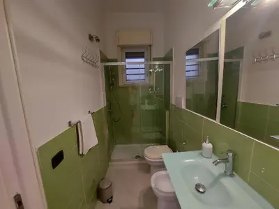 a bathroom with a sink and a toilet and a shower at Teatro Massimo - Apartment with Private Balcony in Palermo