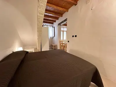 a bedroom with a bed in a room at Marcantonio Suite in Castellammare del Golfo