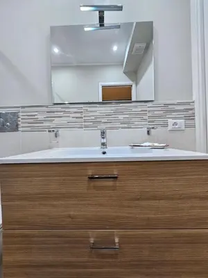 a bathroom with a sink and a mirror at RC SUITE Annunziata in Termini Imerese