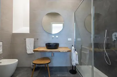 a bathroom with a sink and a mirror at BellaVista in Cinisi