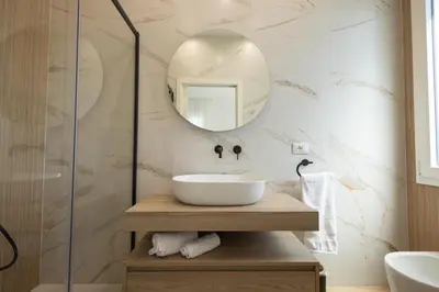 a bathroom with a sink and a mirror at BellaVista in Cinisi