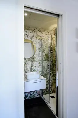 a bathroom with a sink and a mirror at Maciuni Apartment in Palermo