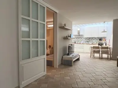 a bathroom with a toilet and a sink at Full Semi-Garden apartment in Villa at Mondello in Palermo