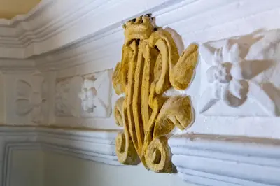 a sculpture on the side of a wall at Abbazia Santa Maria del Bosco in Contessa Entellina