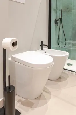 a bathroom with a toilet and a shower at Zahir Suite Apartment in Palermo