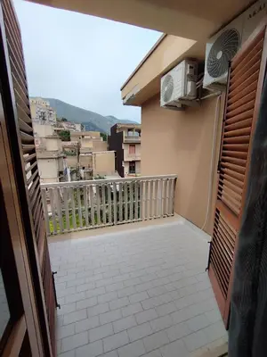 a balcony with a view of a building at V&J appartamenti in Carini