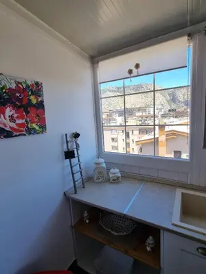a room with a desk and a window with a view at CITY HOUSE & FREE PARKING by Perry-Holiday moderno, panoramico e comodo fino a 6 ospiti in Palermo