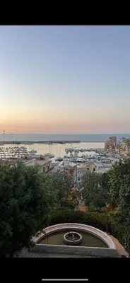 a view of a city with a harbor and the ocean at Casa vinz in Scopello