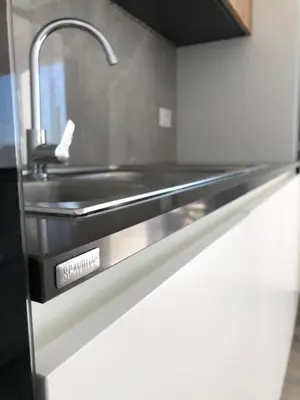 a kitchen with a sink and a stainless steel counter at Villa Marina Luxury in Balestrate