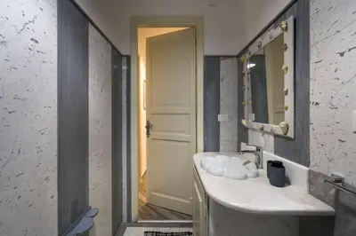 a bathroom with a sink and a mirror at Terrazza Trionfante in Santa Flavia