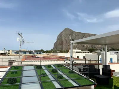 a balcony with a view of a mountain at Camera con terrazza in San Vito lo Capo