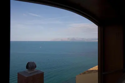 a view of the ocean from a window at Balconi Sul Mare Appartamenti in Castellammare del Golfo