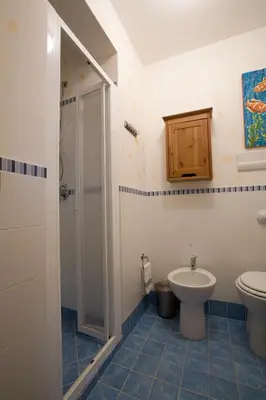 a bathroom with a toilet and a sink at Balconi Sul Mare Appartamenti in Castellammare del Golfo