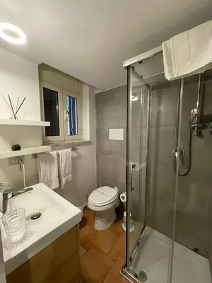 a bathroom with a shower and a toilet and a sink at Punto Politeama in Palermo