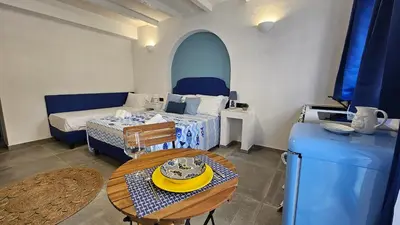 a small room with a bed and a table with a table sidx sidx sidx at Panhouse in Palermo