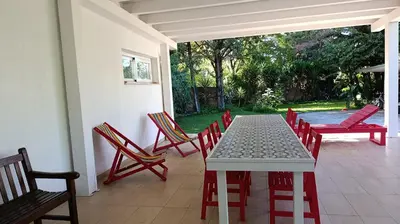 a white table and chairs on a patio with a table and chairs at Villa Ginevra in Mondello