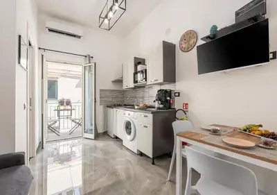 a kitchen with a sink and a dishwasher at Onda blu in Palermo
