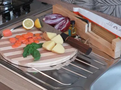 a cutting board with vegetables and a knife on it at Relax nel verde- GioDaPi Palm in Palermo