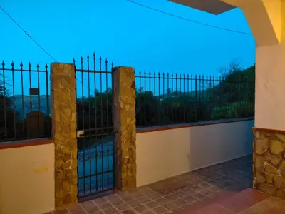 a view from the balcony of a house with a fence at Menzel el Emir in Misilmeri
